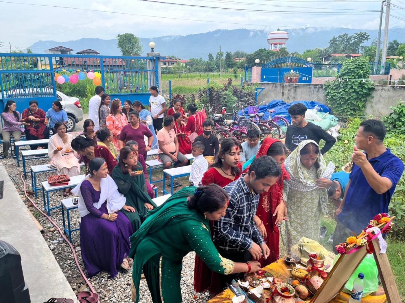 Trishakti Apparel staff and families gathered for a puja ceremony on the factory grounds in Gaindakot, Nepal