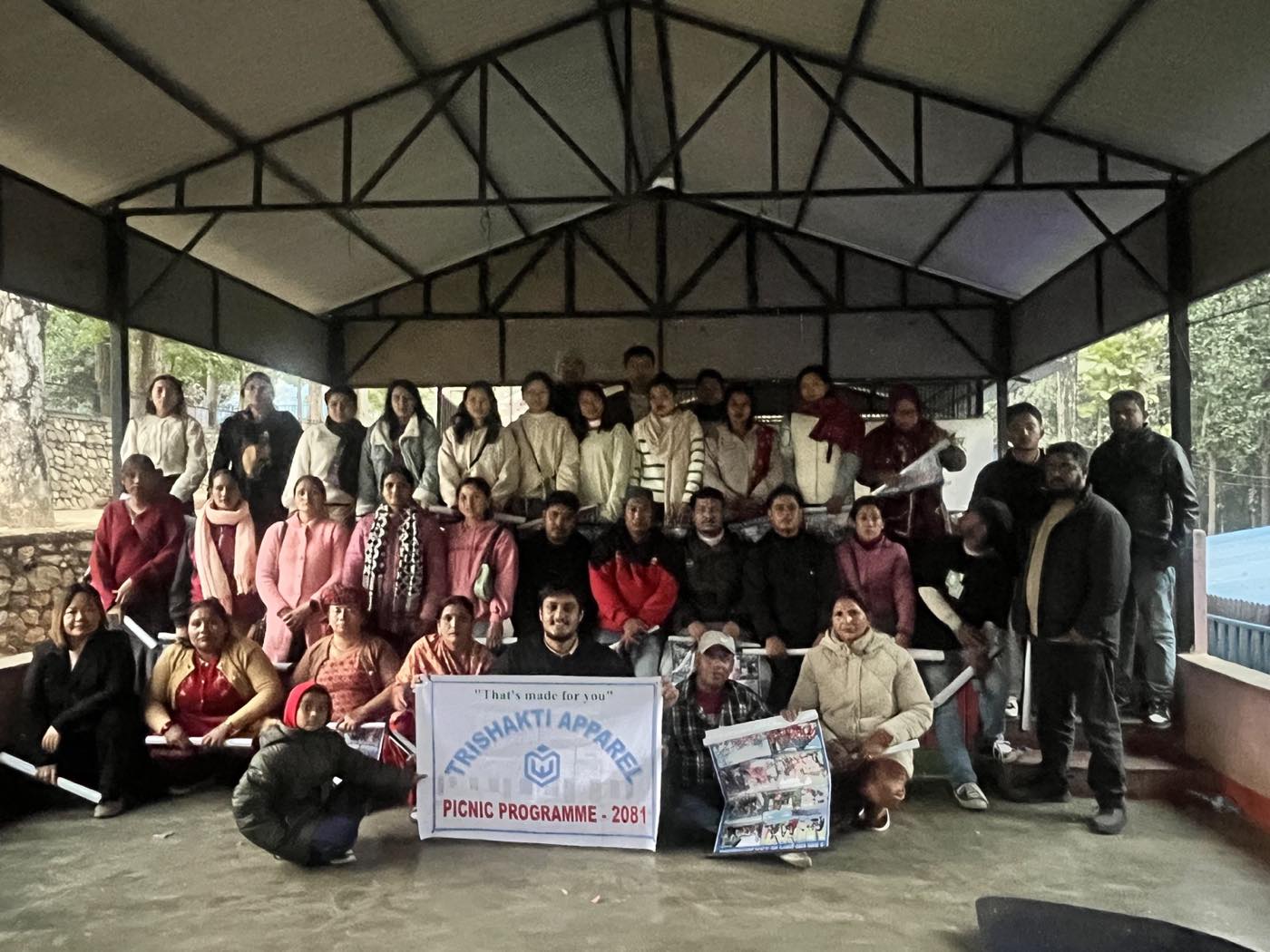 Group photograph of the Trishakti Apparel team at the 2081 company picnic programme