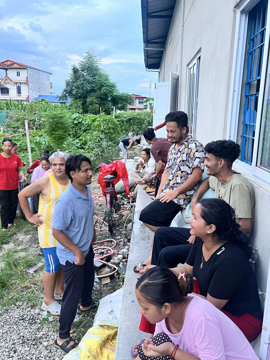 Trishakti Apparel staff and families gathered on the factory grounds in Gaindakot, Nepal