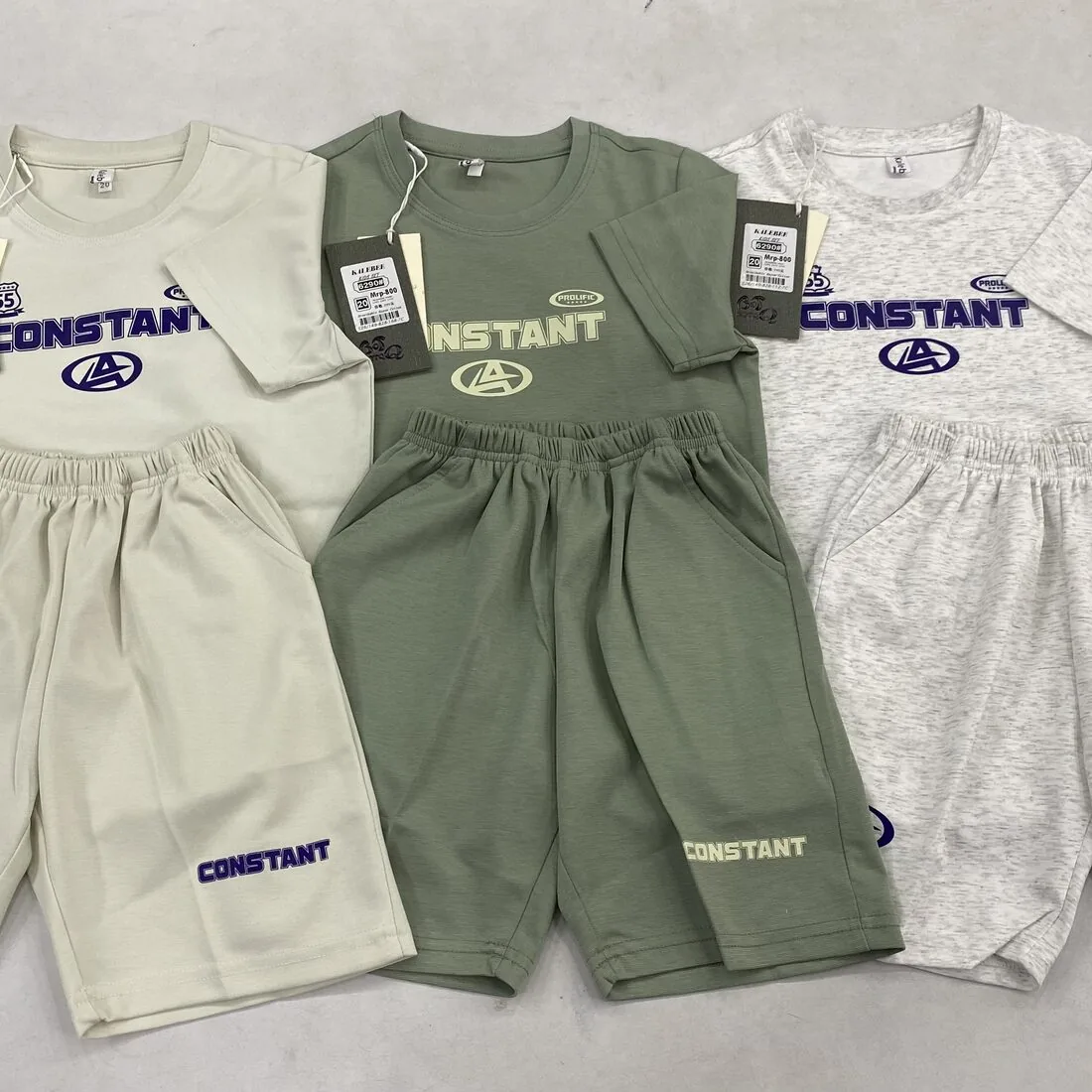 Kids’ co-ord knit t-shirt and shorts sets laid flat