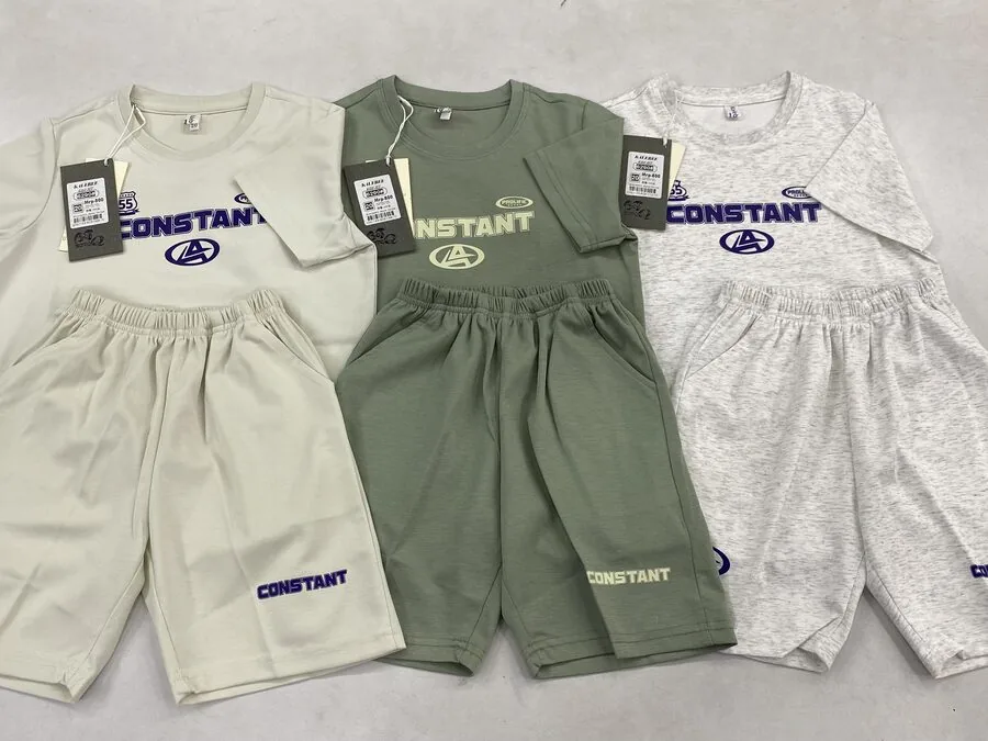 Kids’ co-ord knit t-shirt and shorts sets laid flat with hangtags