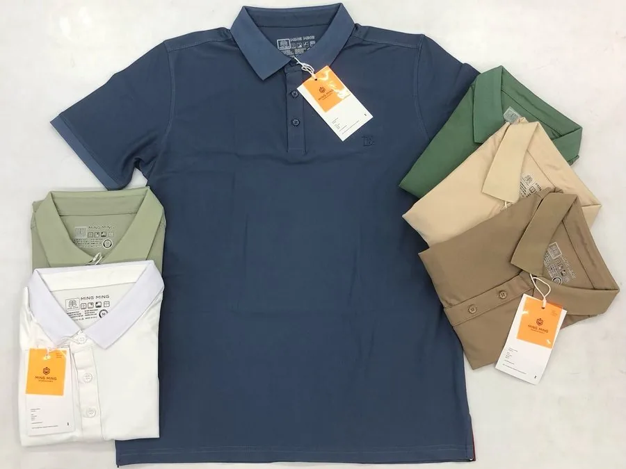 Private-label pique polo shirts folded with brand hangtags